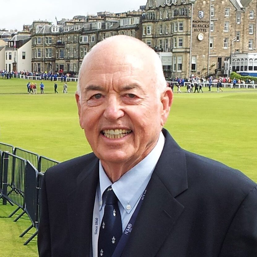 Smiling older man at golf course.